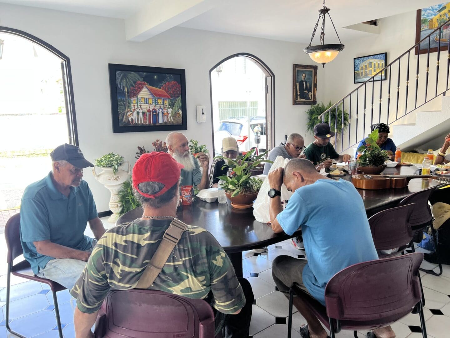 A group of people sitting at tables in a room.